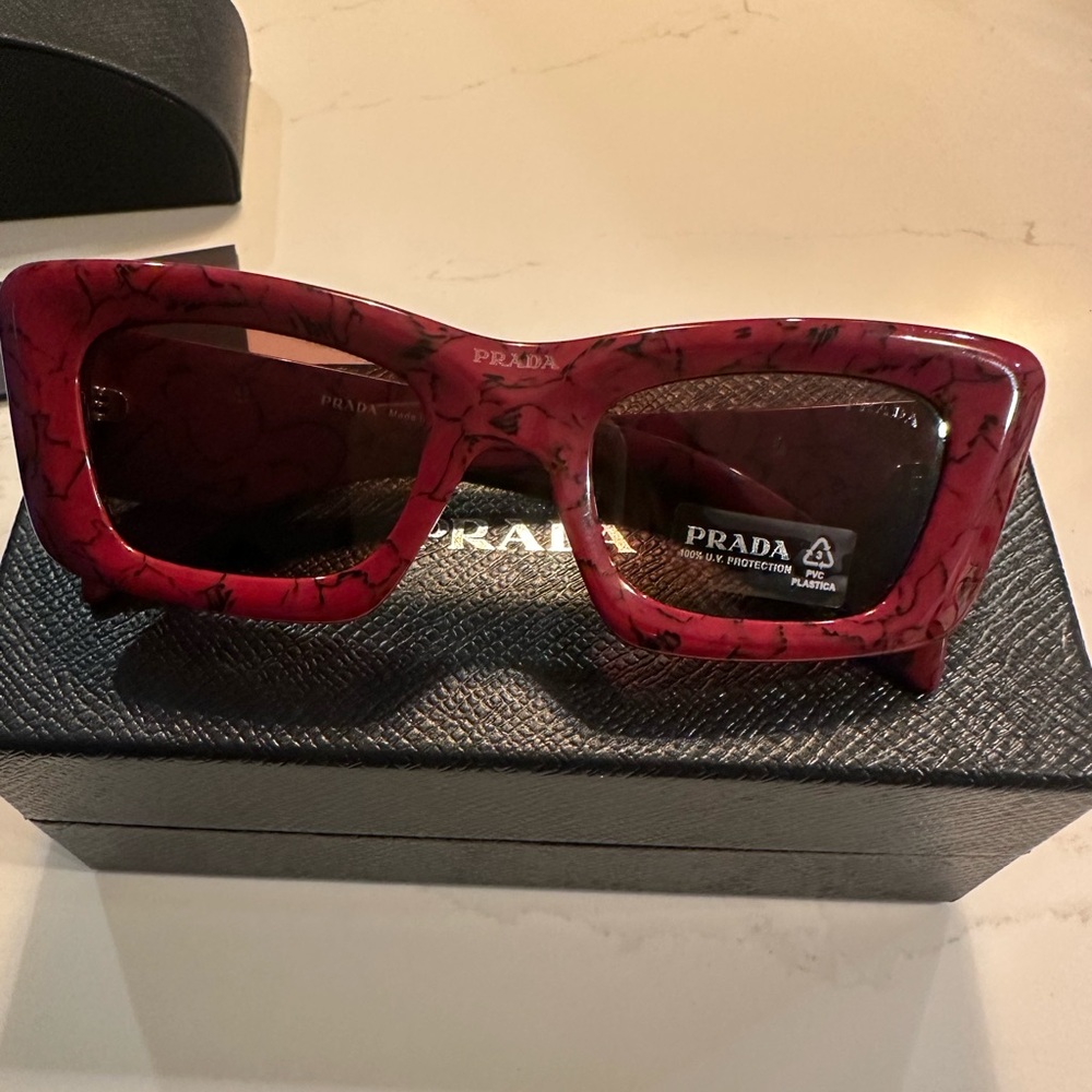 Brand new Prada sunglasses.
